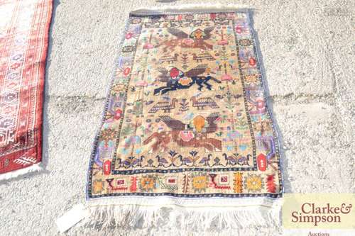 An Eastern wool rug,B decorated with animals and t