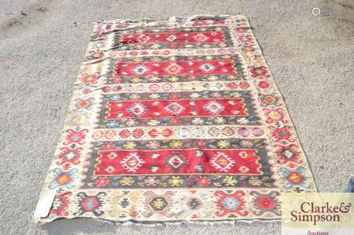 A flat weave Kelim rug, of traditional pattern and