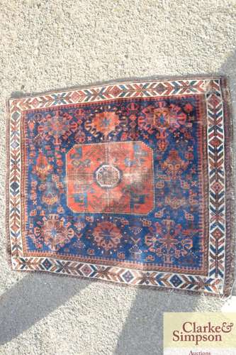 A small Kelim rug, (worn) 25 x 21!