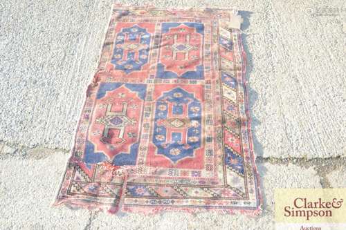 A flat weave rug, with lozenge decoration on a pre