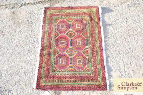 A small brightly coloured Eastern wool mat, 2 x 2