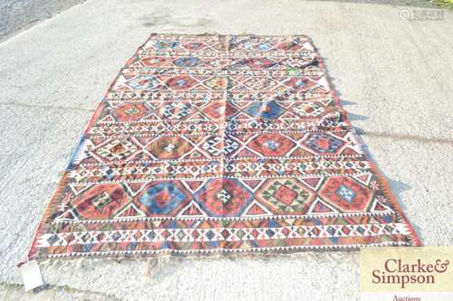 A large Kelim rug, of traditional form,104 x 62