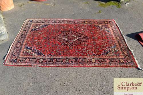 A Middle Eastern floral pattern rug, having profus