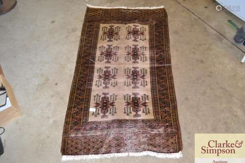 An unusual Tekke style rug, with cream fieldstylised two row...