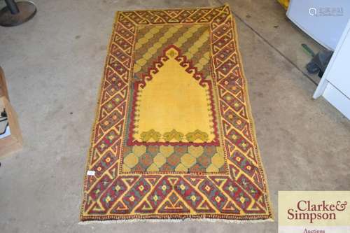 A Caucasian prayer rug,the plain hooked Mihrab with a geomet...