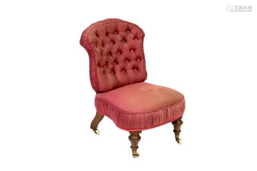 A Victorian childs button back chair,with red silk upholster...