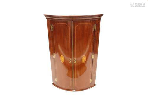 A 19th Century mahogany ellipticalcorner cupboard,enclosed b...