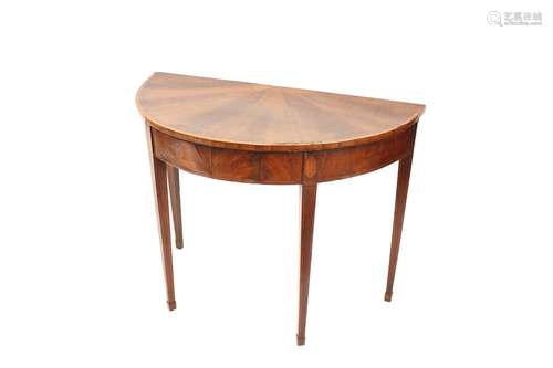 A George III mahogany demi-lune side table,raised on square ...