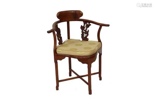 A pair of Chinese hard wood corner chairs,having foliate and...