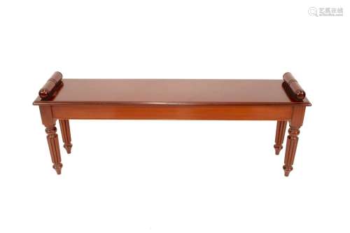 A Regency style mahogany window seat,with scrolled arm rests...