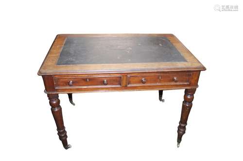 A Victorian mahogany writing table, having leatherette inset...