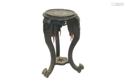 An rbonised plant stand, on elephant supports, 33c