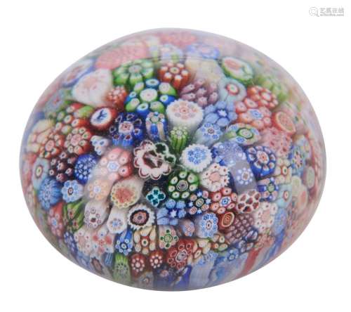 A MINIATURE FRENCH MILLEFIORI PAPERWEIGHT BY BACCARAT, DATED...