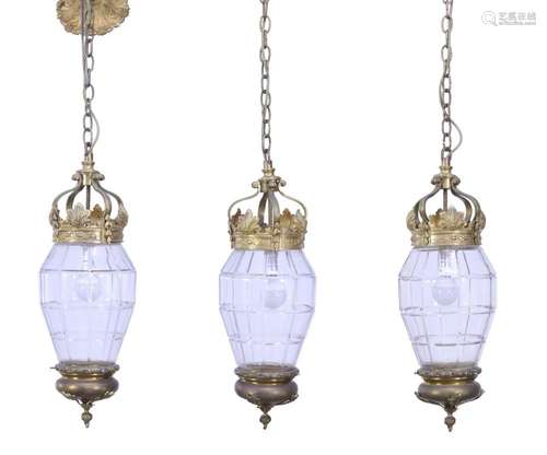 A SET OF THREE FRENCH GLASS, GILDED BRONZE AND BRASS LANTERN...