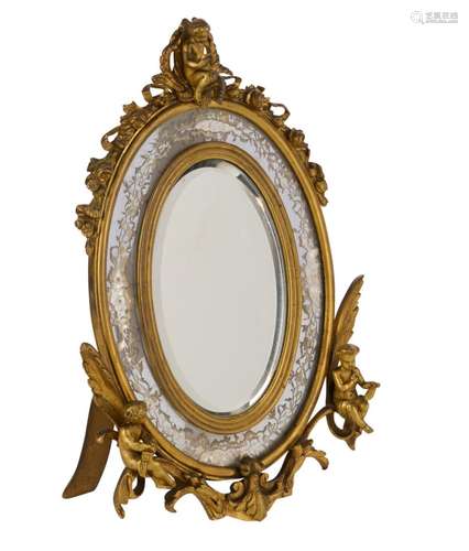 A FRENCH BRASS AND VERRE ÉGLOMISÉ TABLE MIRROR RETAILED BY A...