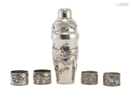 A CHINESE SILVER COCKTAIL SHAKER TOGETHER WITH FOUR NAPKIN R...