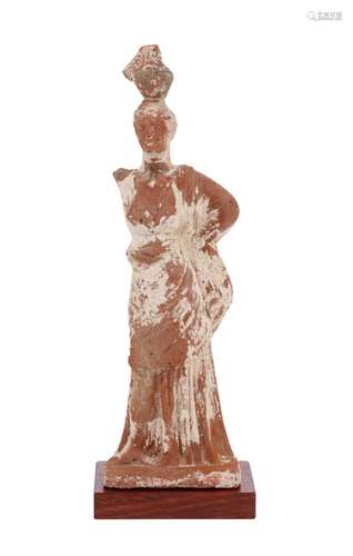 A FINELY MOULDED TANAGRA FEMALE FIGURE CIRCA 300 B.C.