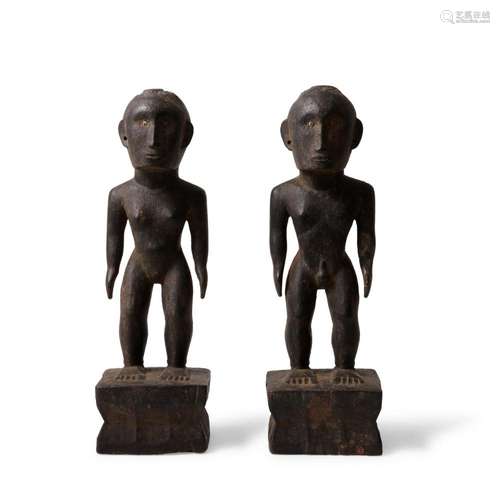 A PAIR OF PHILLIPINE ISLANDS WOODEN GUARDIAN FIGURES 'BU...