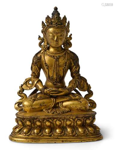 A TIBETO-CHINESE GILT-BRONZE FIGURE OF AMITAYUS QING DYNASTY...