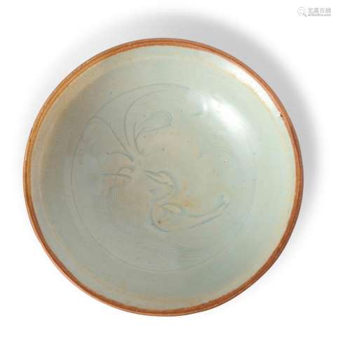 A CHINESE QINGBAI BOWL WITH CARVED DUCK AND LOTUS DESIGN YUA...