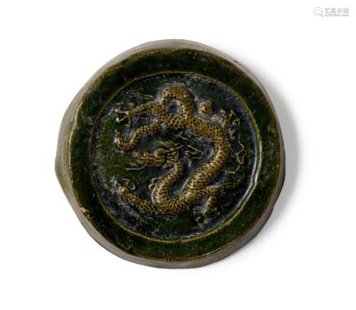 A CHINESE IMPERIAL DRAGON-DECORATED ROOF-TILE END FRAGMENT M...