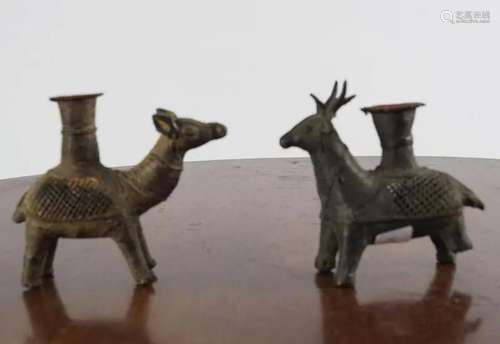 FOUR EARLY BRONZE CANDLE HOLDERS