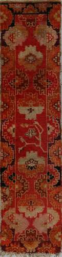 . A Tibetan rug fragment decorated with flowers Early