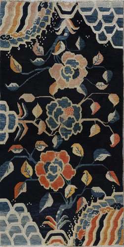 . A Tibetan rug with peonies early 20th century .