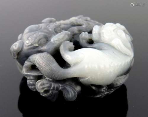 A Chinese black and white jade pendant c