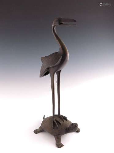 A Japanese bronze model of a stork stand