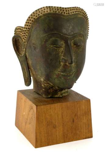 A bronze sculpture of a Buddha head, Tha