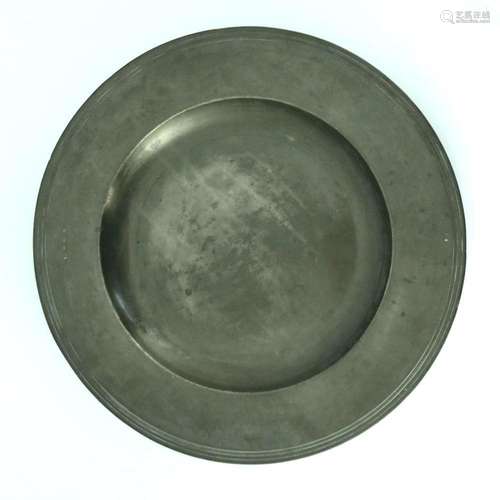 A Charles II broad-rimmed pewter charger