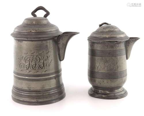 A pewter lidded pint and 1/2 pint measur