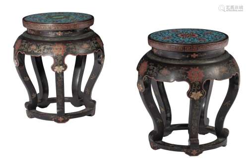A pair of Chinese lacquered garden seats, with cloisonné ena...