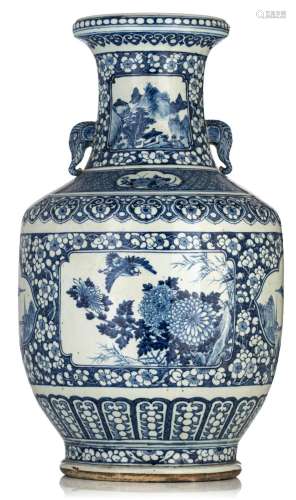 A Chinese blue and white vase, paired with elephant handles,...
