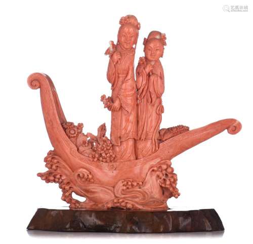 A Chinese sculpted red-coral group, fixed on a base, late Qi...