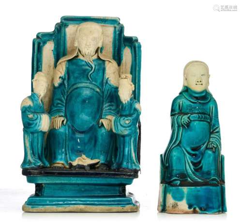 Two turquoise and aubergine glazed biscuit figures of Zhenwu...