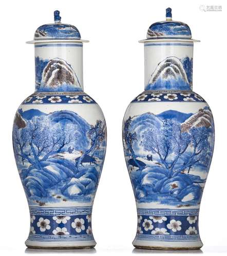 A pair of Chinese blue and white and copper-red baluster vas...