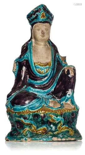 A Chinese Fahua ware figure of a seated Guanyin, late Ming p...