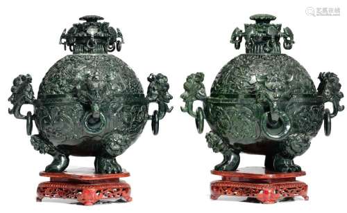 A monumental pair of Chinese dark green jade censers and cov...