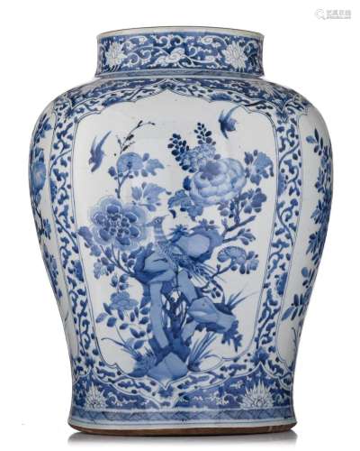 A Chinese blue and white floral decorated vase, the panels w...