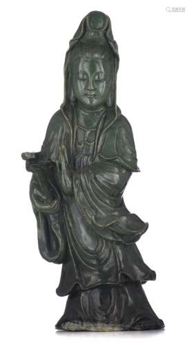 A large Chinese dark green jade figure of a standing Guanyin...