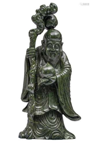 A Chinese dark green jadeite carved figure of Shou Xing, W 4...