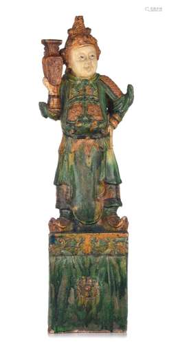 A Chinese sancai-glazed stoneware figure of a temple guardia...