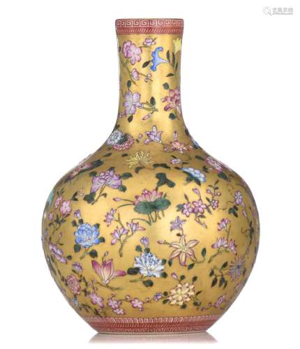 A Chinese famille rose and gilt bottle vase, with a Qianlong...