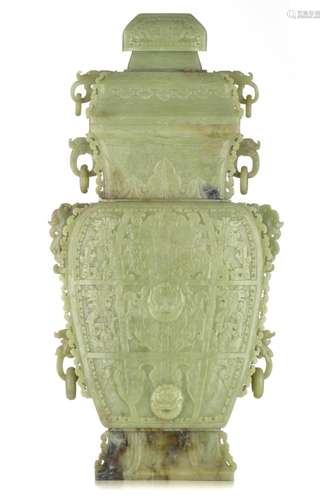 A monumental Chinese green celadon jade carving of an archai...