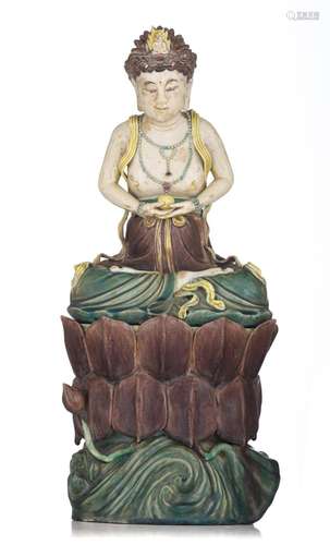 A Chinese famille verte biscuit figure of a seated Bodhisatt...