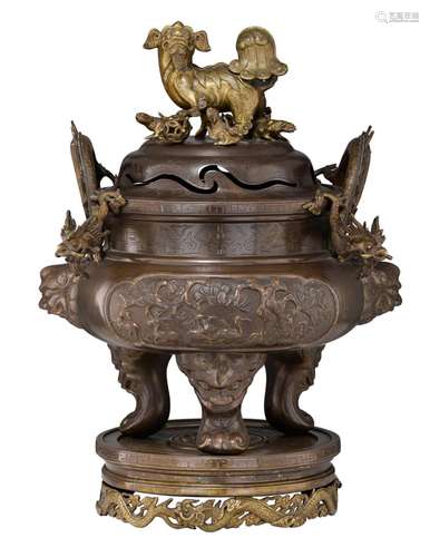 A large Chinese partial gilt bronze tripod censer and cover,...