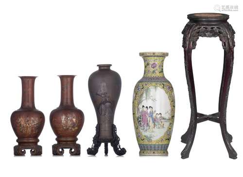 A collection of three Chinese lacquered wood vases and a fam...