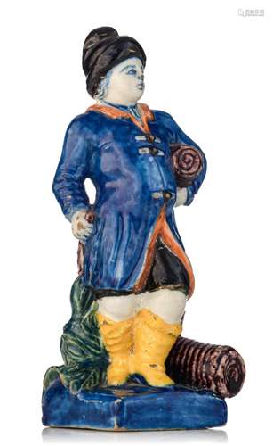 A fine Dutch Delft polychrome figure of a tobacco merchant, ...